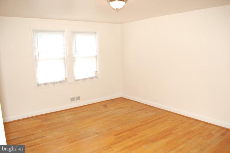 1660 Northbourne Road Baltimore, MD 21239 - Photo 4 of 11 a view of a room that has a window in it