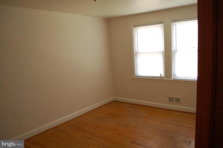 1660 Northbourne Road Baltimore, MD 21239 - Photo 6 of 11 an empty room with a window