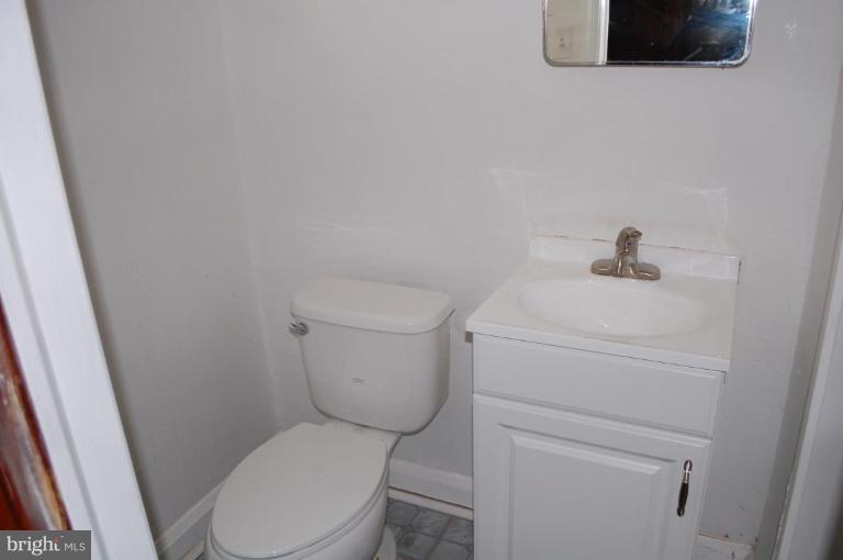 1660 Northbourne Road Baltimore, MD 21239 - Photo 8 of 11 a white toilet sitting next to a white sink