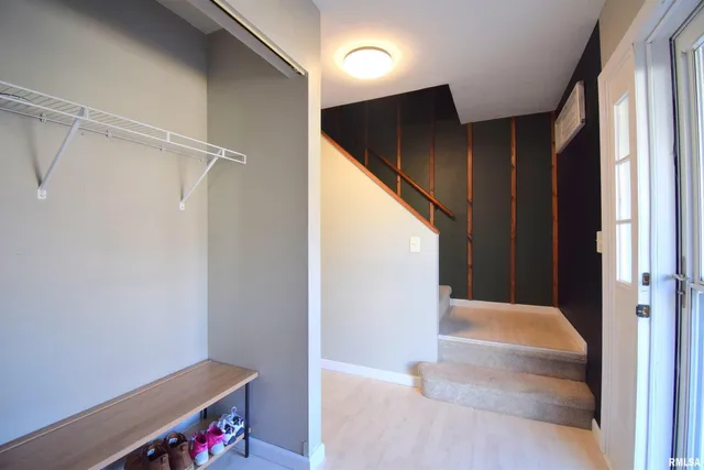 a view of entryway with hallway and closet