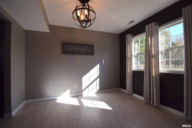 a view of empty room with windows