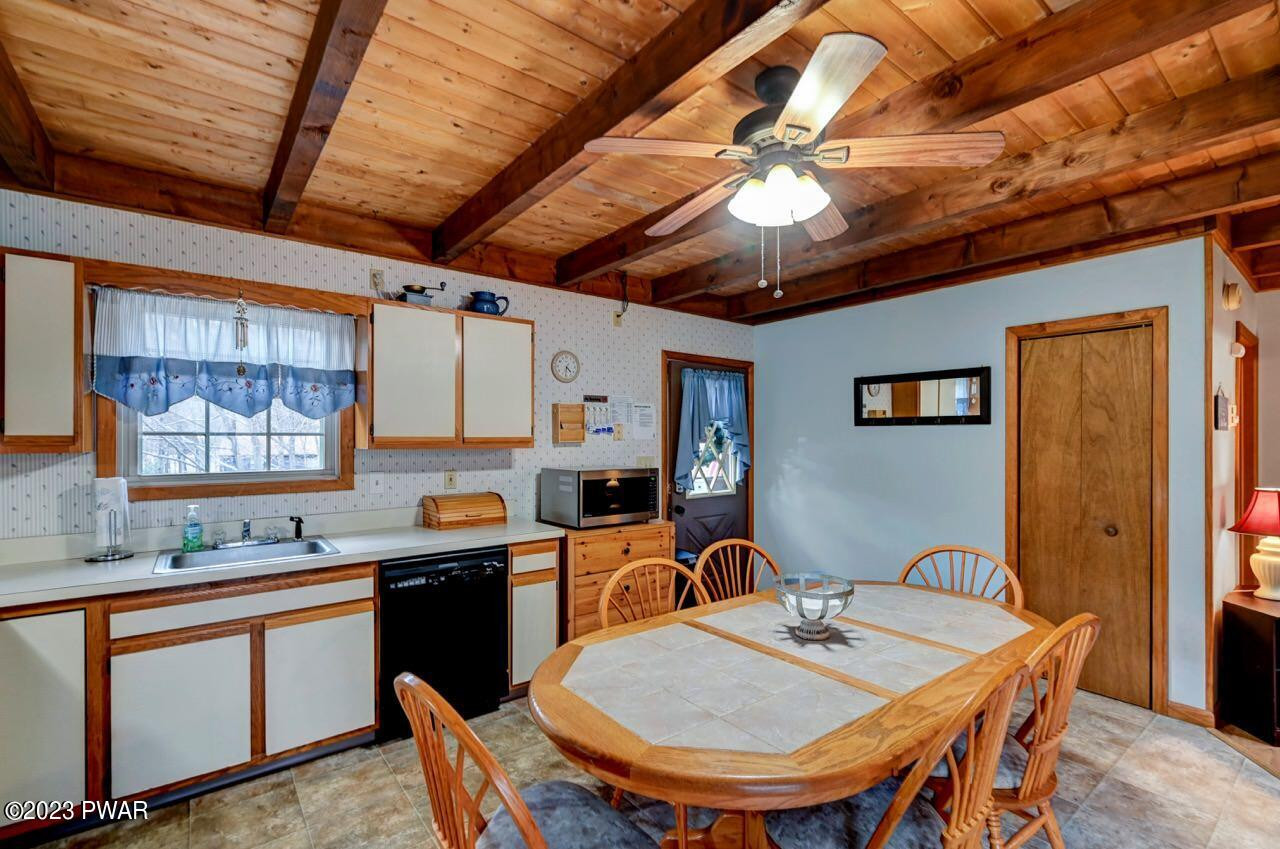 413 Northgate Road Lake Ariel, PA 18436 - Photo 24 of 59 a kitchen with a table chairs sink and cabinets