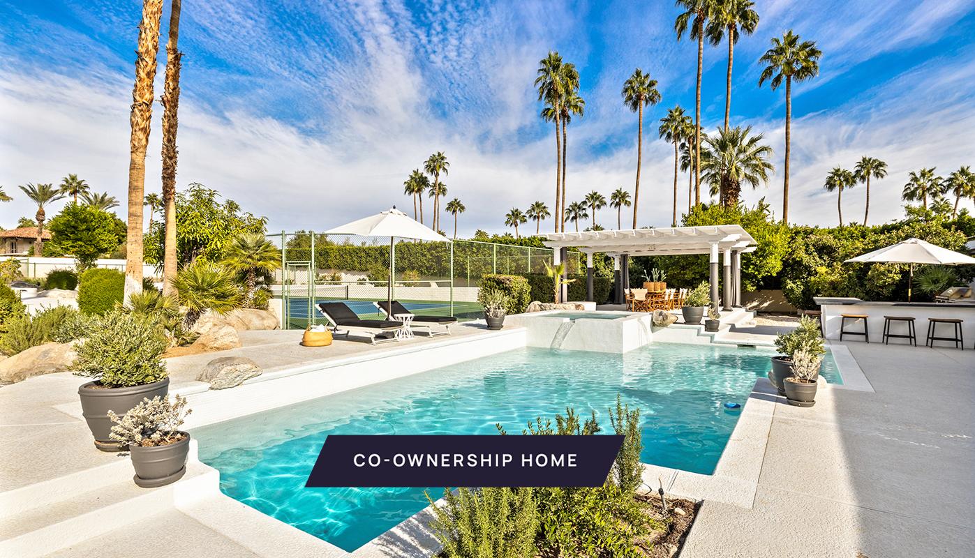 a view of a swimming pool with a patio