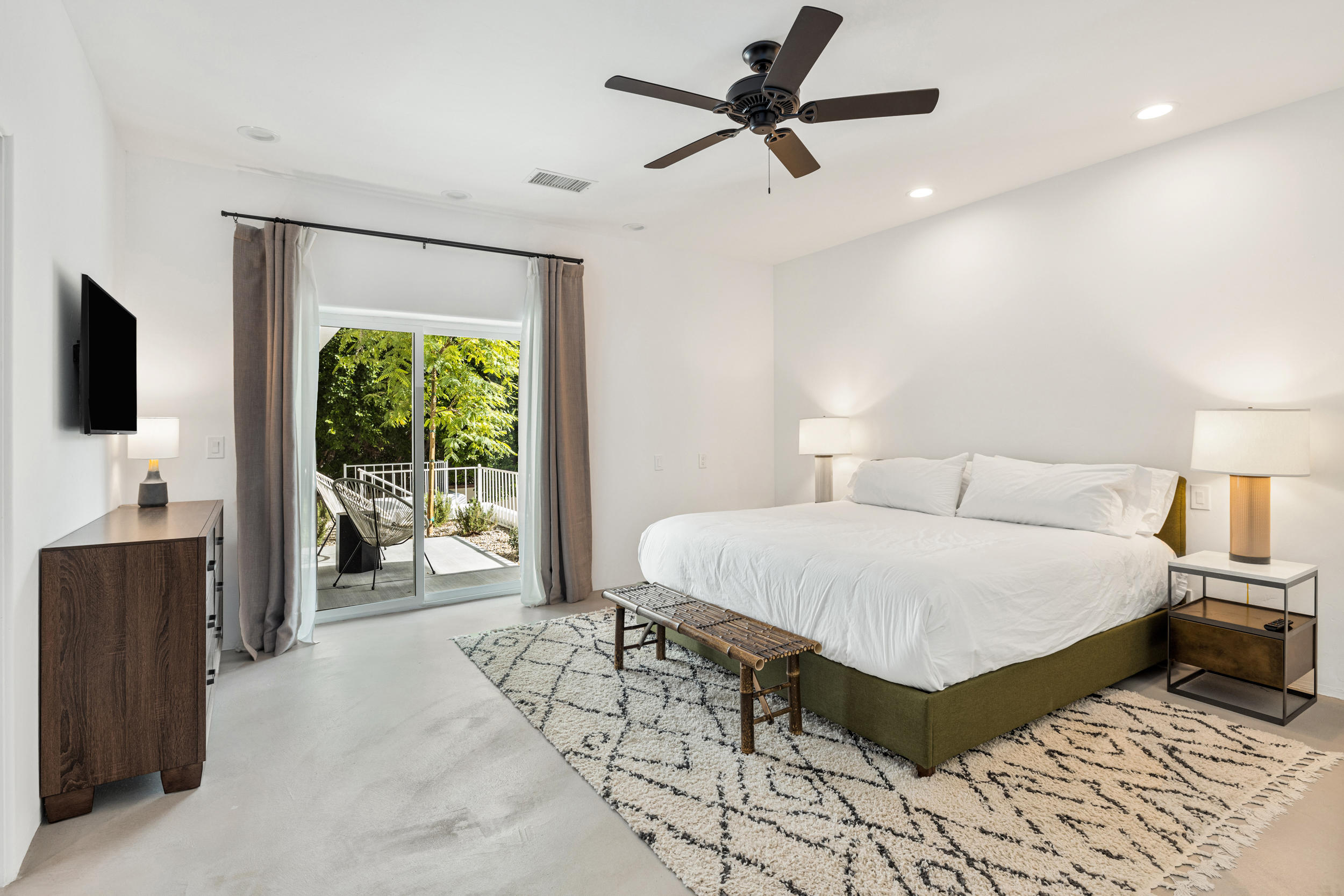 594 West Stevens Road, Unit A Palm Springs, CA 92262 - Photo 108 of 133 a spacious bedroom with a bed and glass walk in closet