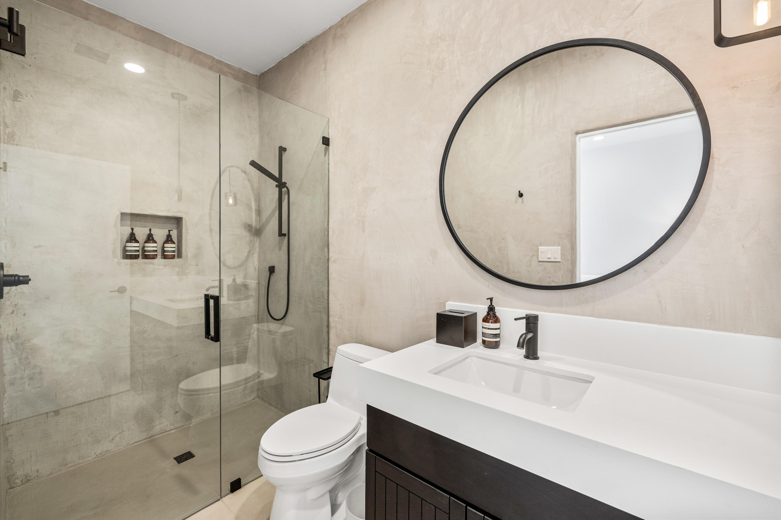 594 West Stevens Road, Unit A Palm Springs, CA 92262 - Photo 118 of 133 a bathroom with a sink a mirror a toilet and a shower