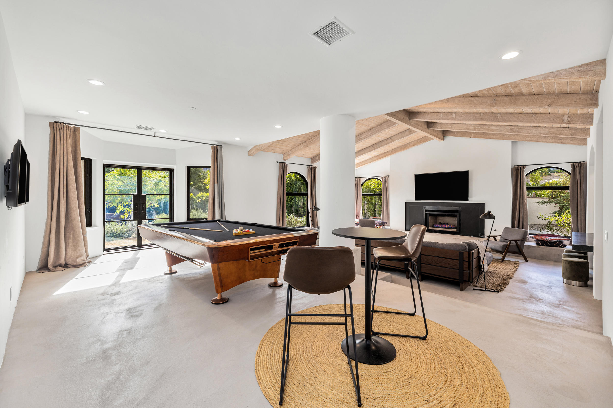 594 West Stevens Road, Unit A Palm Springs, CA 92262 - Photo 3 of 133 a living room with furniture and a flat screen tv
