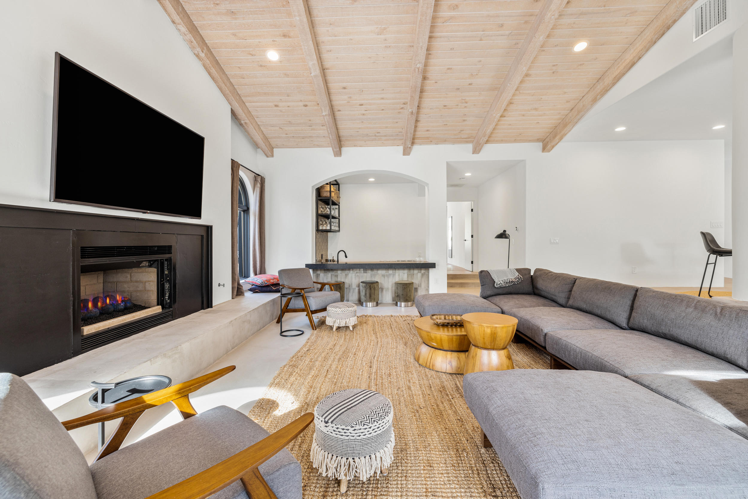 594 West Stevens Road, Unit A Palm Springs, CA 92262 - Photo 40 of 133 a living room with furniture a flat screen tv and a fireplace