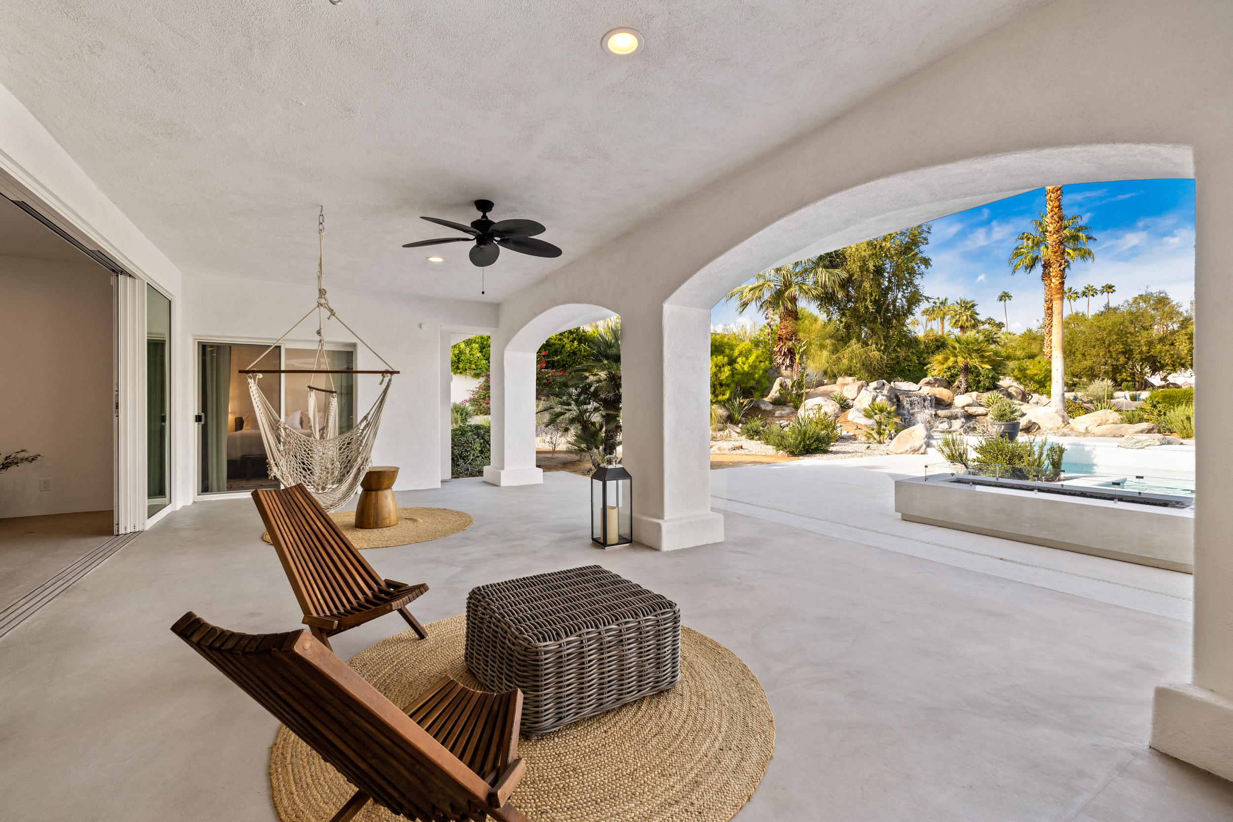 594 West Stevens Road, Unit A Palm Springs, CA 92262 - Photo 59 of 133 a living room with furniture a chandelier and a large window