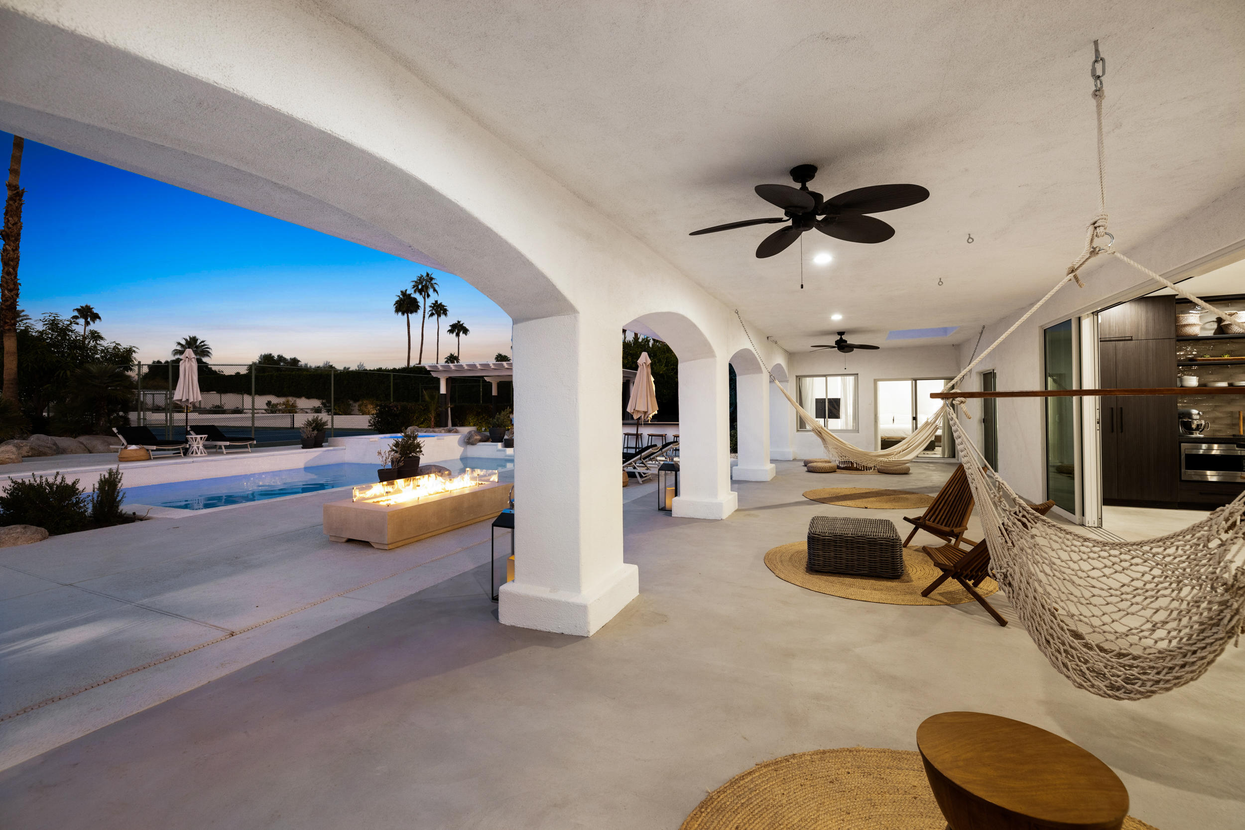 594 West Stevens Road, Unit A Palm Springs, CA 92262 - Photo 60 of 133 a living room with furniture and a flat screen tv