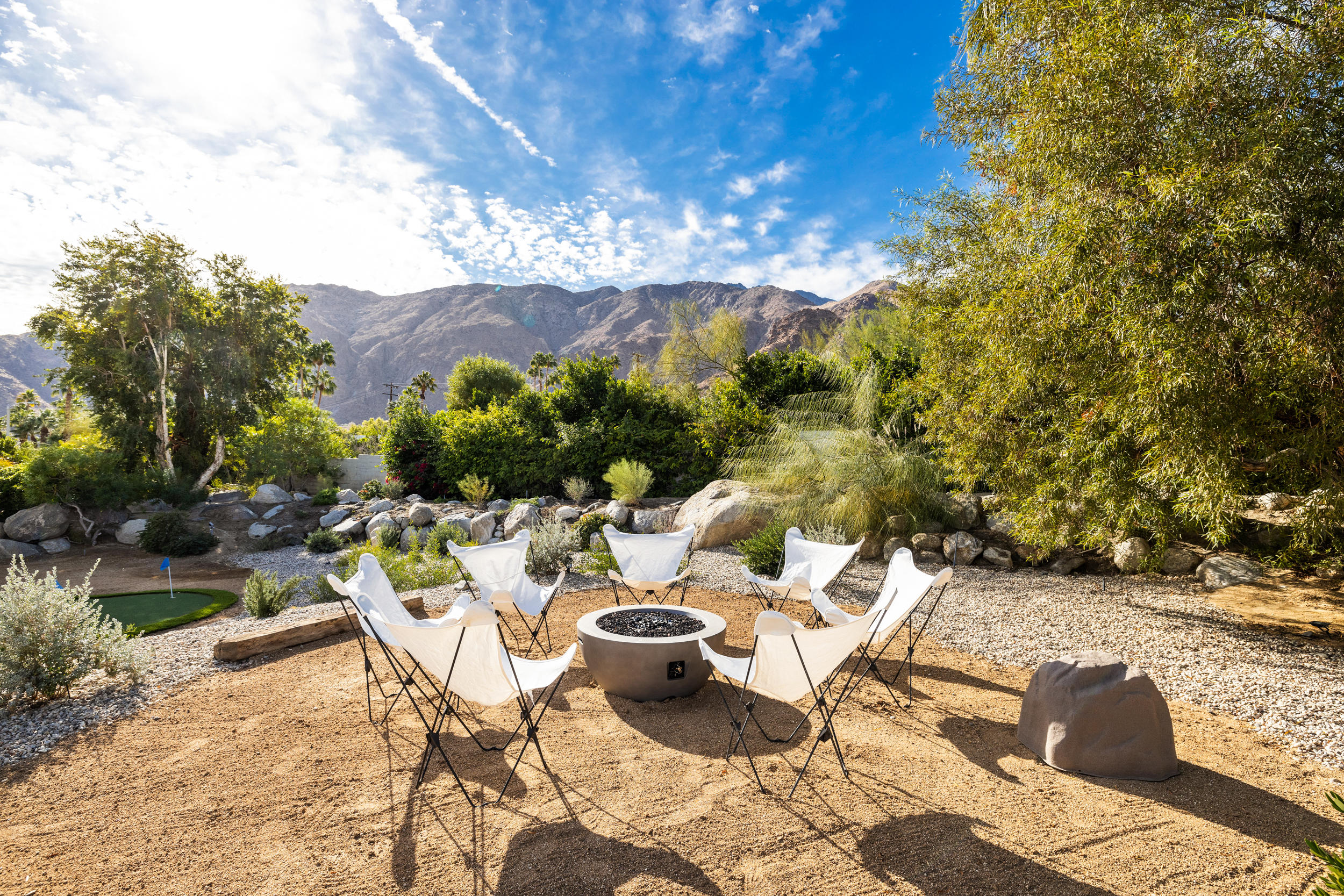 594 West Stevens Road, Unit A Palm Springs, CA 92262 - Photo 74 of 133 a view of a lounge chair and table in the patio