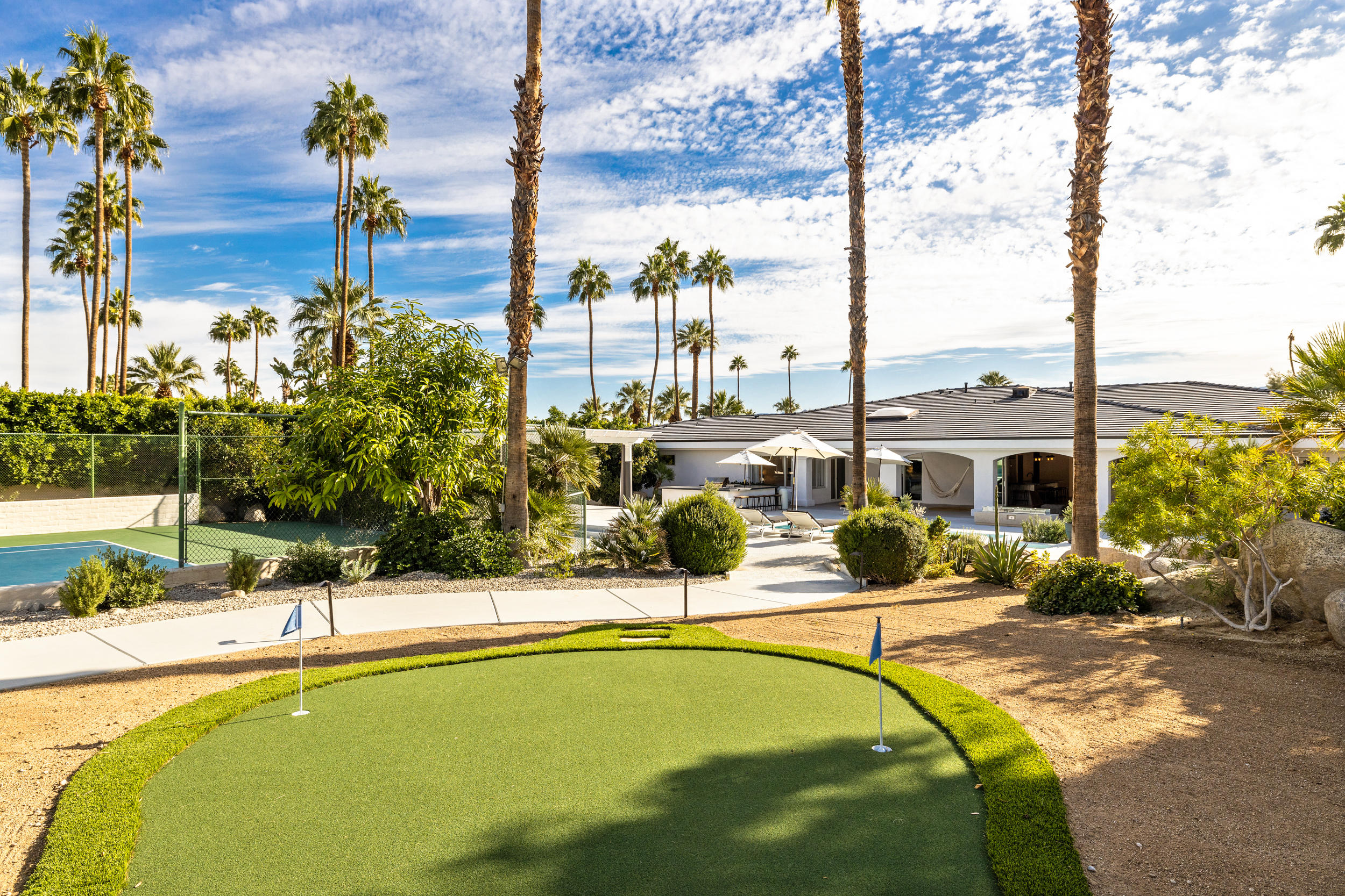 594 West Stevens Road, Unit A Palm Springs, CA 92262 - Photo 80 of 133 a swimming pool with outdoor seating