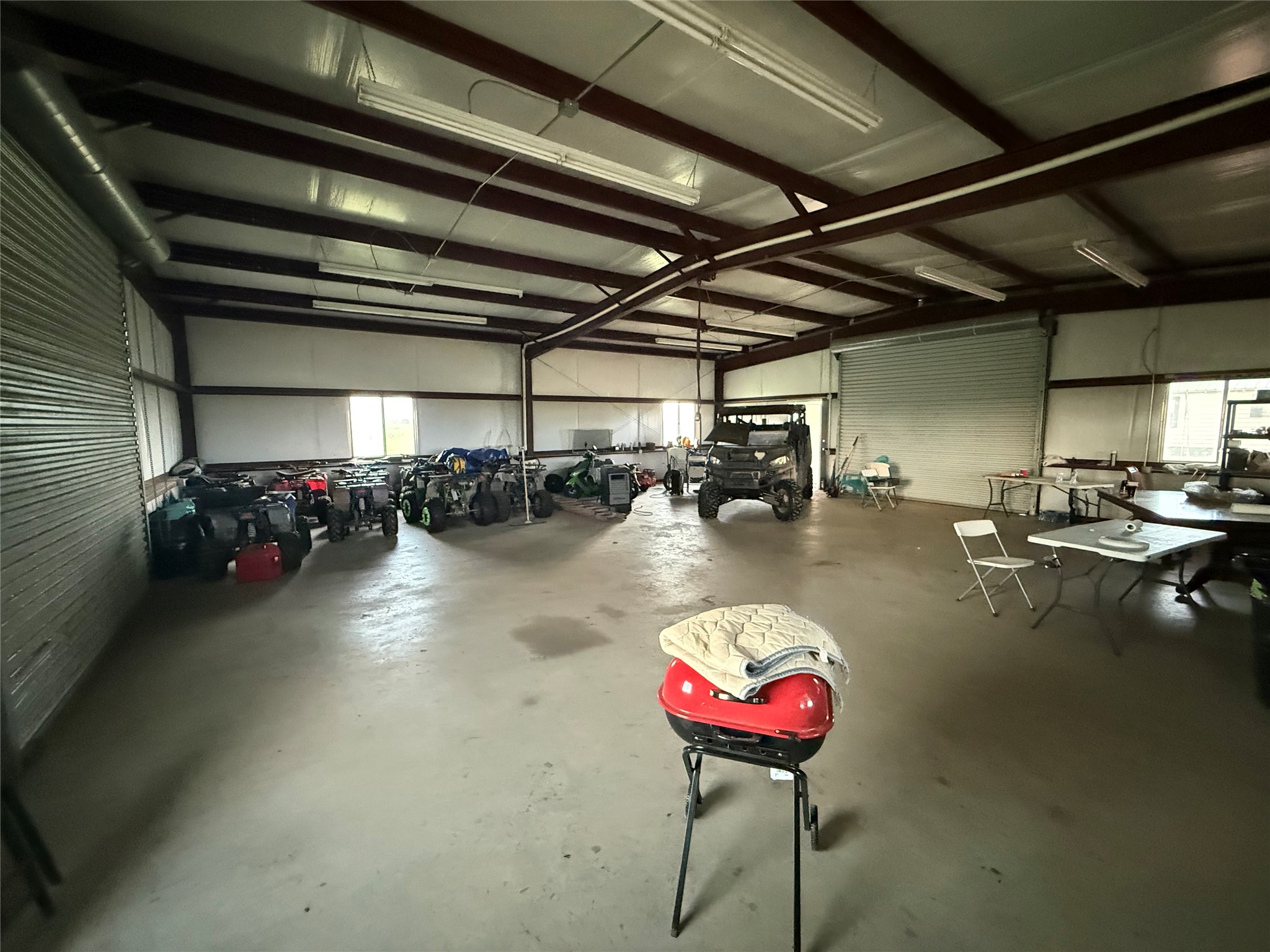 1240 Crooked Road Cat Spring, TX 78933 - Photo 11 of 20 a view of a swimming pool with a lot of potted plants