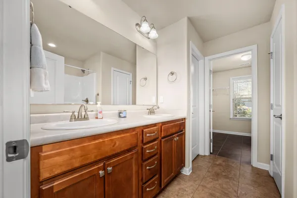 a bathroom with a shower curtain and a shower curtain