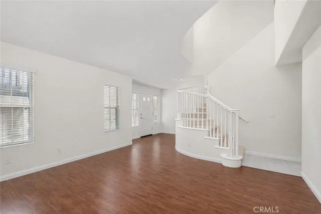 a bathroom with double sink and a mirror