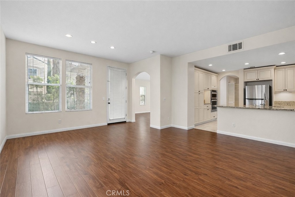 9 Diamant Way Aliso Viejo, CA 92656 - Photo 8 of 33 a view of an empty room with wooden floor and a window