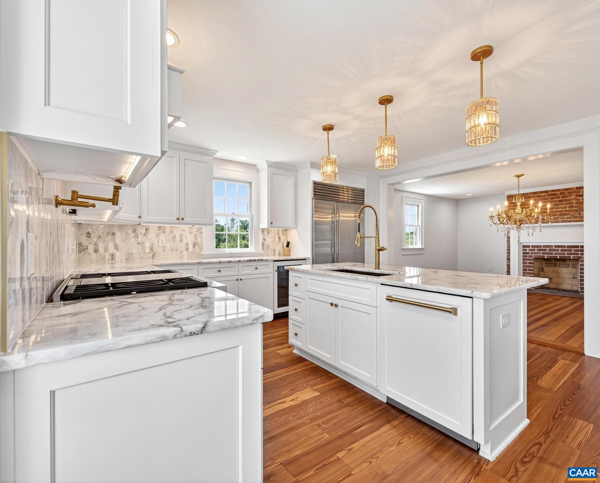 481 Race Ground Road Somerset, VA 22972 - Photo 14 of 53 a kitchen with stainless steel appliances granite countertop a stove and a sink