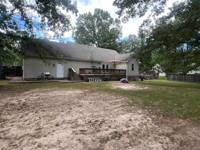 a view of outdoor space with deck and green space