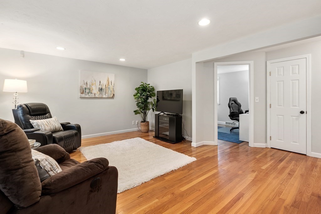 12 Cypress Road Natick, MA 01760 - Photo 13 of 41 a living room with furniture and a flat screen tv