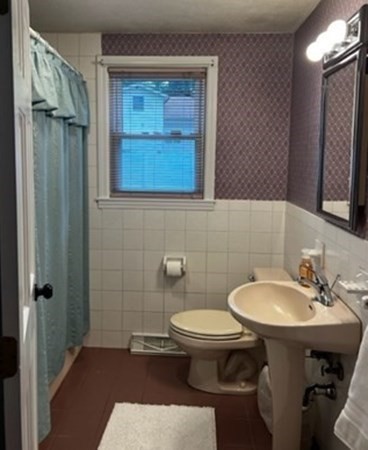 12 Cypress Road Natick, MA 01760 - Photo 16 of 41 a bathroom with a sink toilet and shower