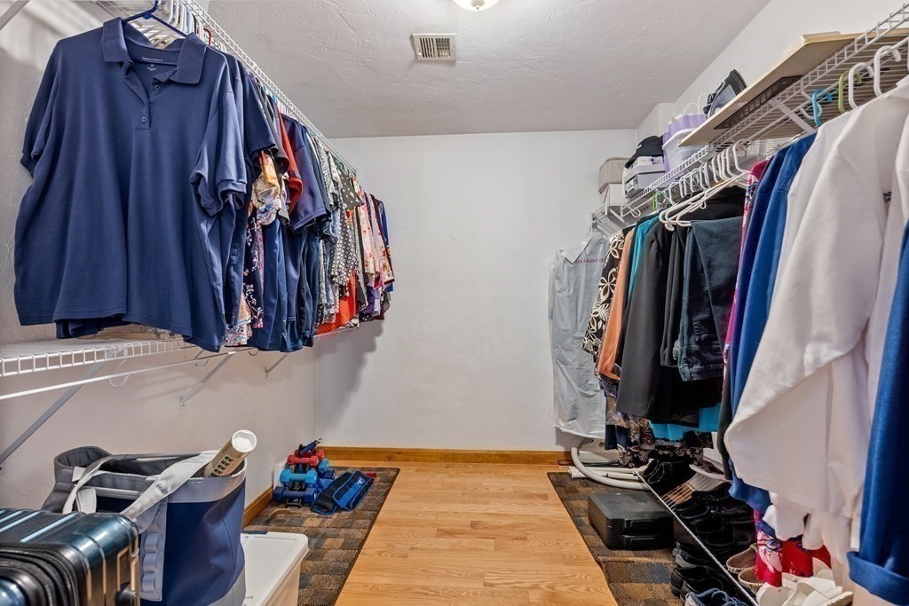 12 Cypress Road Natick, MA 01760 - Photo 21 of 41 a view of walk in closet with clothes and shoes