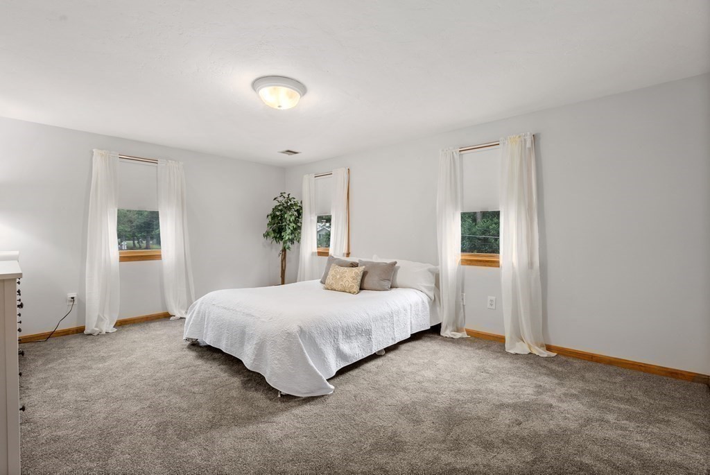 12 Cypress Road Natick, MA 01760 - Photo 23 of 41 a bedroom with a bed and a window