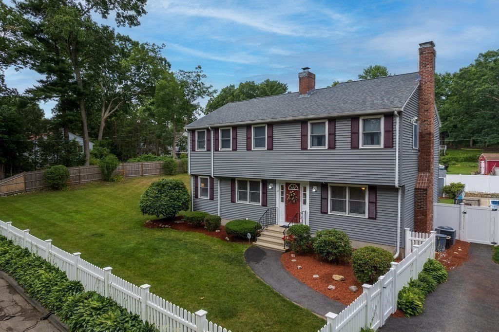 12 Cypress Road Natick, MA 01760 - Photo 32 of 41 a front view of a house with a yard