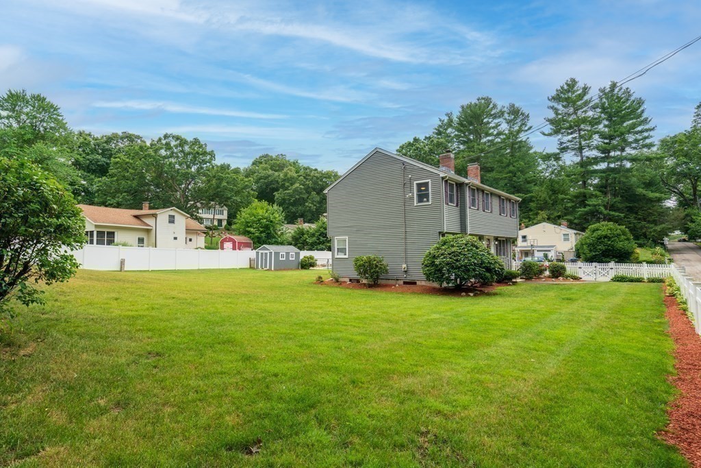 12 Cypress Road Natick, MA 01760 - Photo 33 of 41 a front view of a house with garden