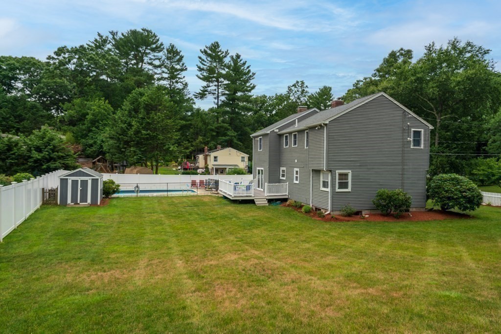 12 Cypress Road Natick, MA 01760 - Photo 34 of 41 a backyard of a house with table and chairs