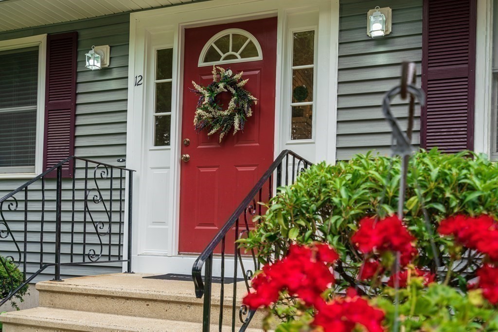 12 Cypress Road Natick, MA 01760 - Photo 40 of 41 a vase of flowers sitting in front of a door