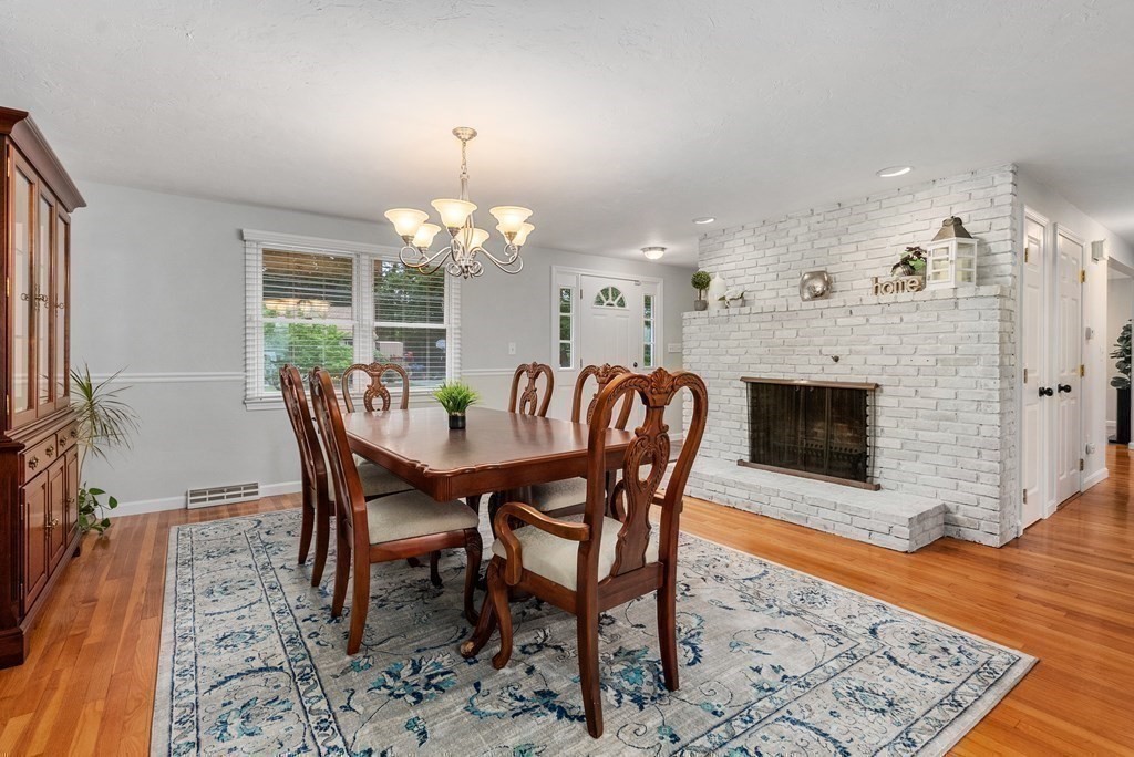 12 Cypress Road Natick, MA 01760 - Photo 4 of 41 a view of a dining room with furniture and wooden floor
