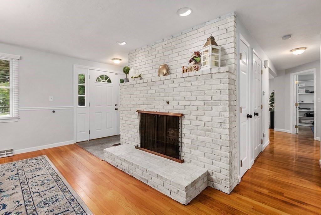12 Cypress Road Natick, MA 01760 - Photo 5 of 41 a living room with furniture and a fireplace