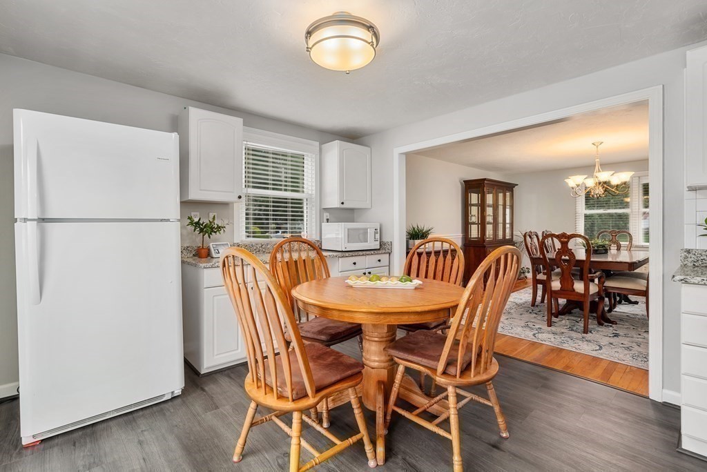 12 Cypress Road Natick, MA 01760 - Photo 6 of 41 a view of a dining room with furniture window and wooden floor