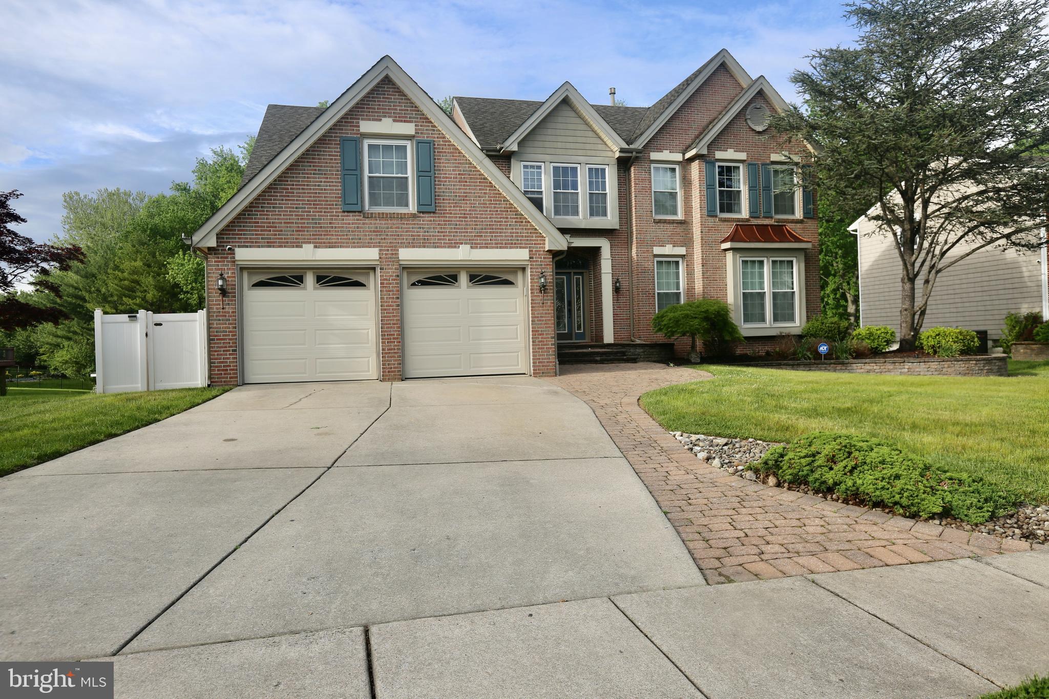 16 Cotswold Way Sewell, NJ 08080 - Photo 2 of 52 a front view of a house with a yard