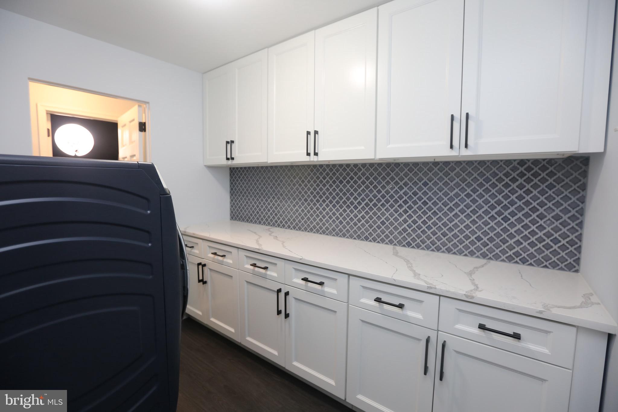 16 Cotswold Way Sewell, NJ 08080 - Photo 23 of 52 a kitchen with white cabinets and sink