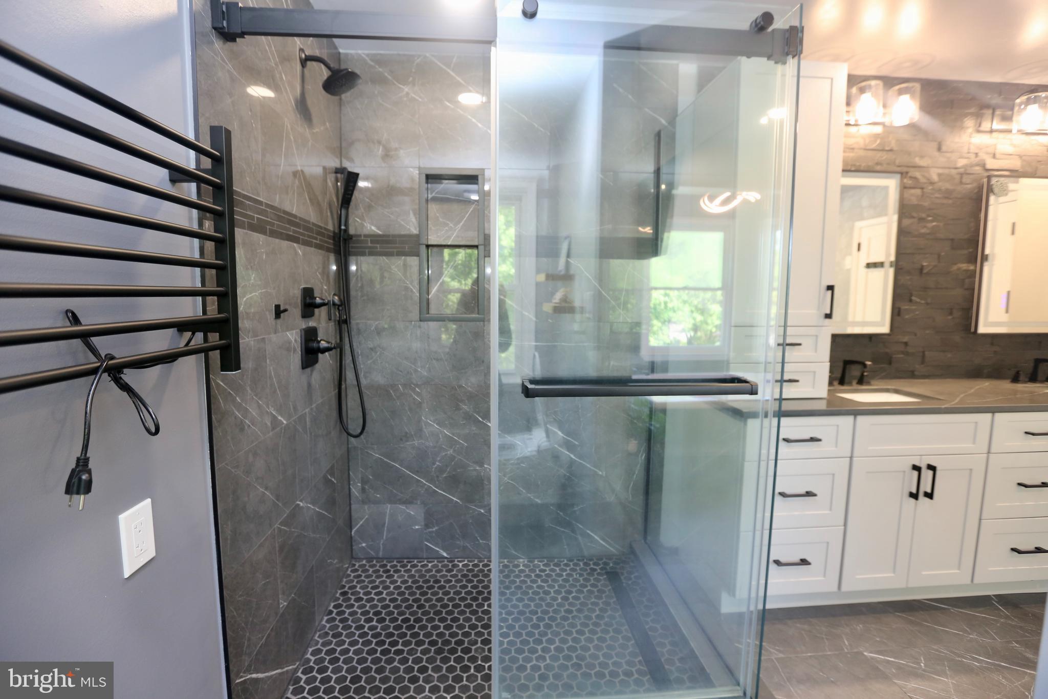 16 Cotswold Way Sewell, NJ 08080 - Photo 35 of 52 a bathroom with a shower and a sink