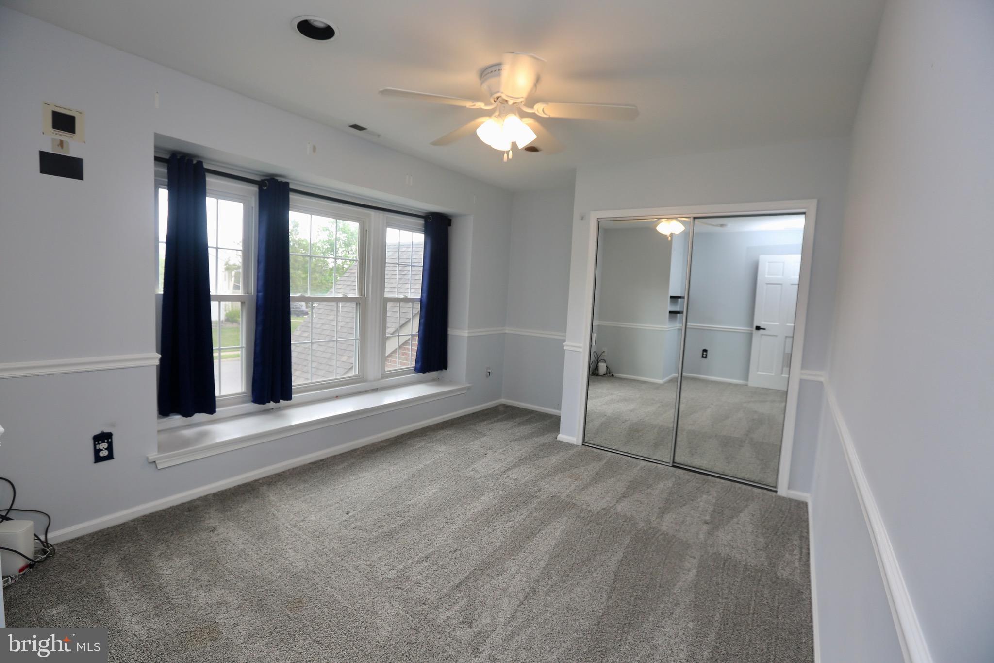 16 Cotswold Way Sewell, NJ 08080 - Photo 39 of 52 a view of an empty room with a fireplace and a window