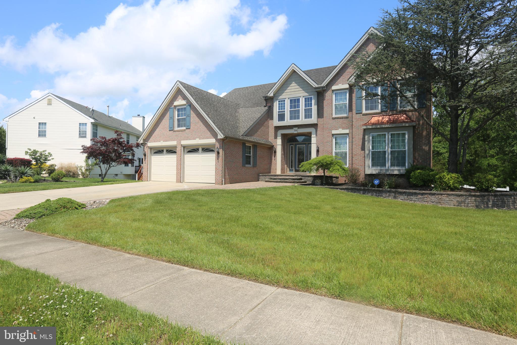 16 Cotswold Way Sewell, NJ 08080 - Photo 4 of 52 a front view of a house with a yard and trees