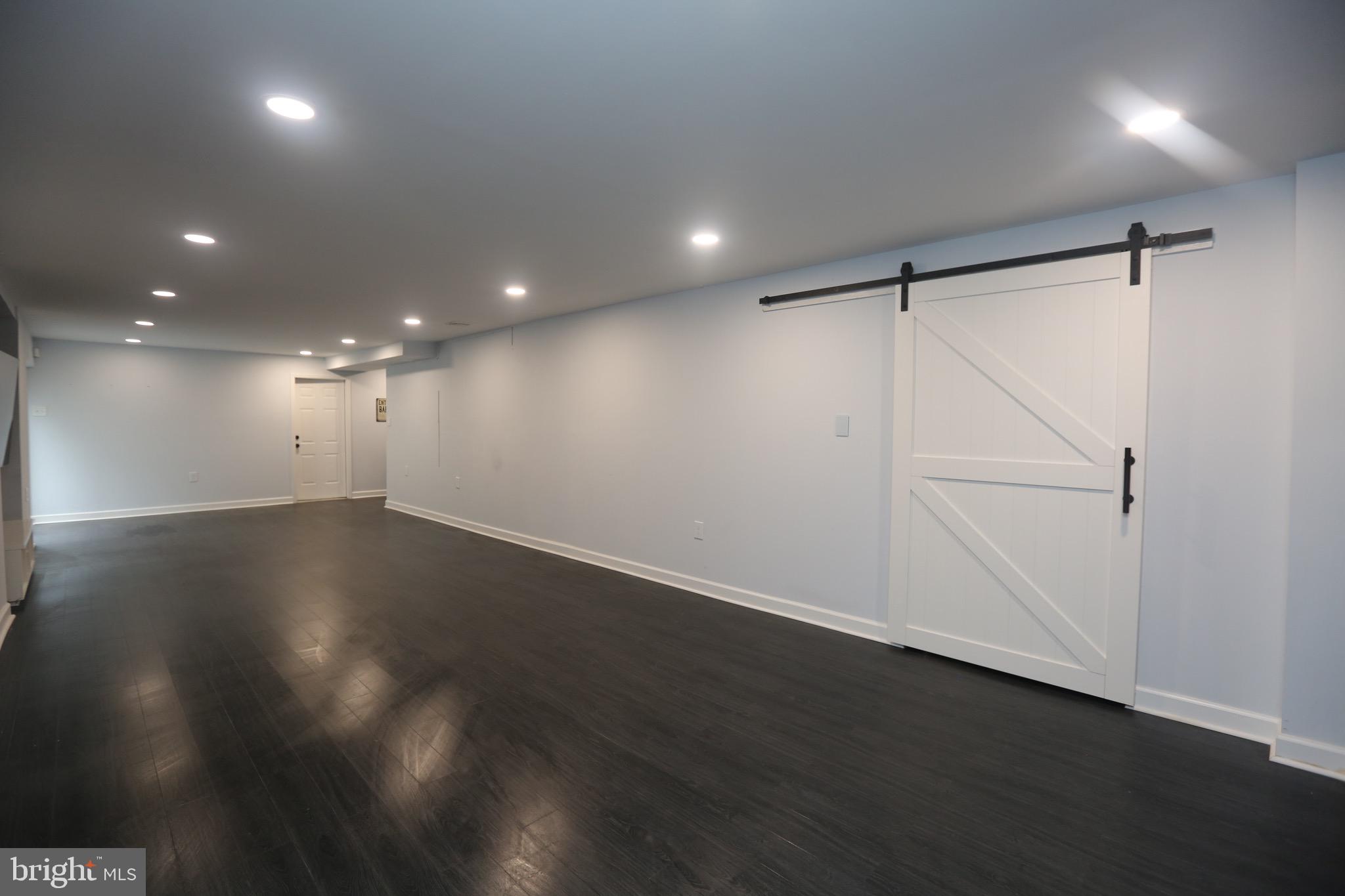 16 Cotswold Way Sewell, NJ 08080 - Photo 43 of 52 an empty room with wooden floor and white walls