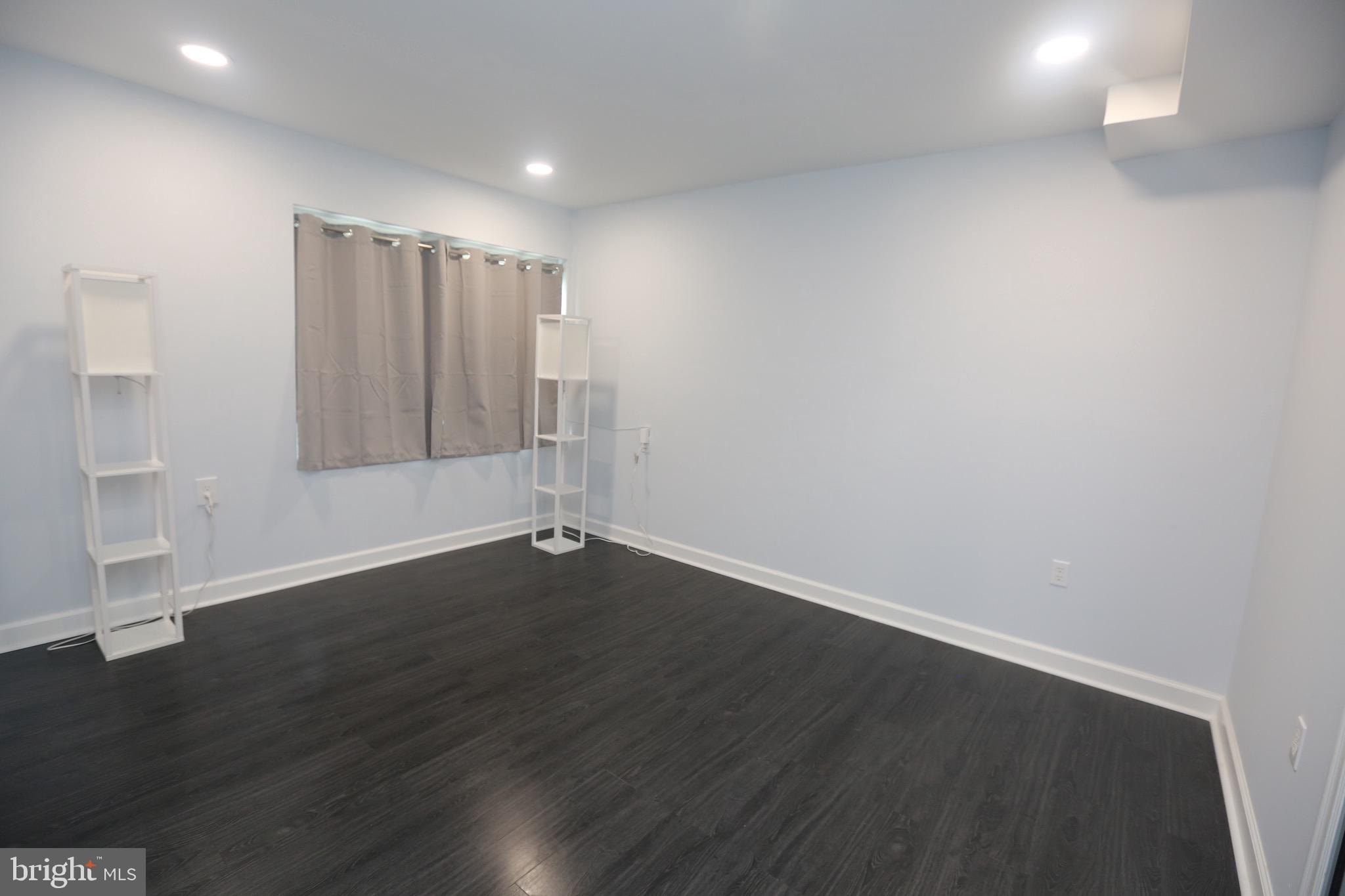 16 Cotswold Way Sewell, NJ 08080 - Photo 46 of 52 an empty room with wooden floor and windows