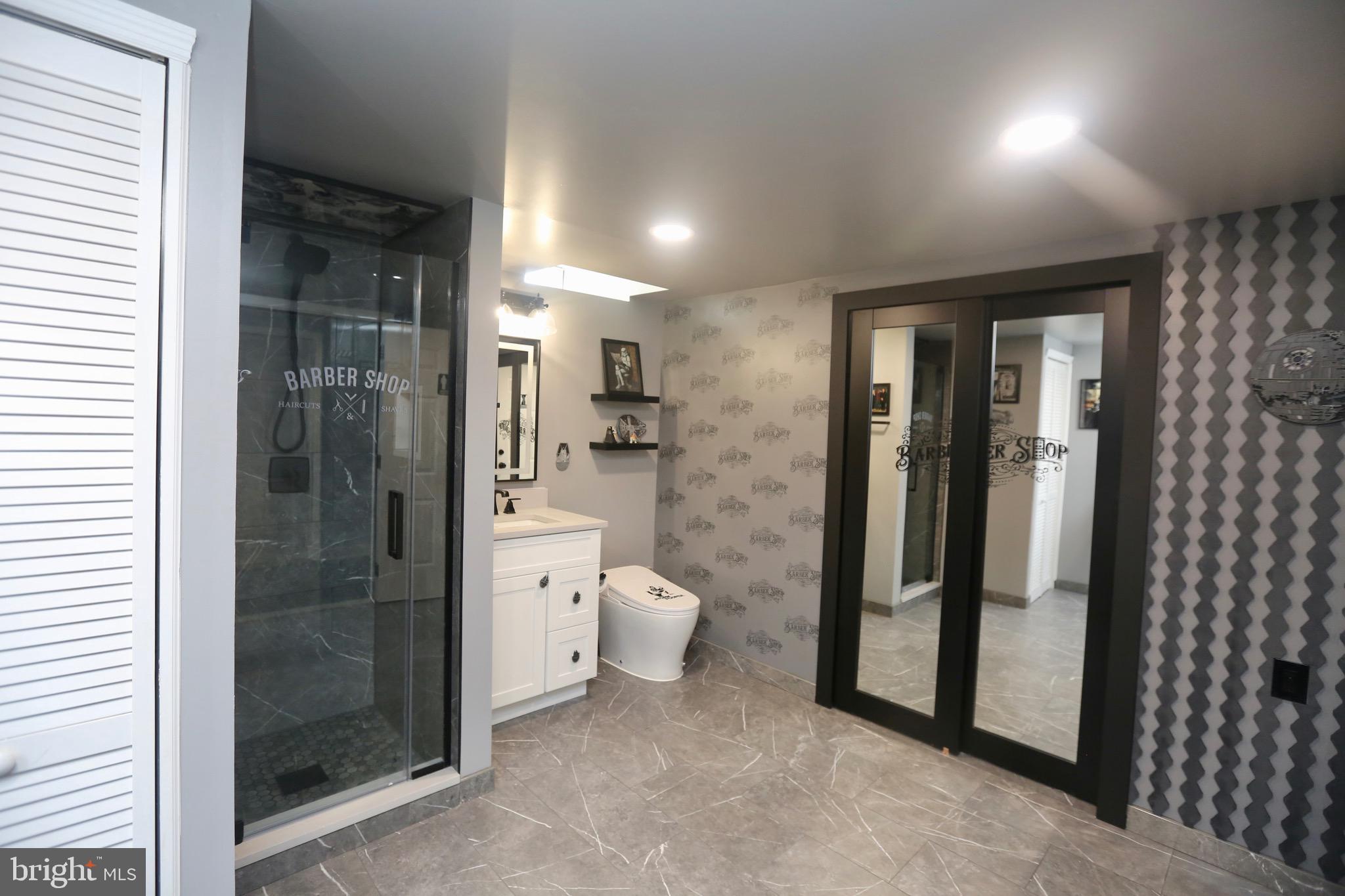 16 Cotswold Way Sewell, NJ 08080 - Photo 48 of 52 a bathroom with a glass shower door and a toilet