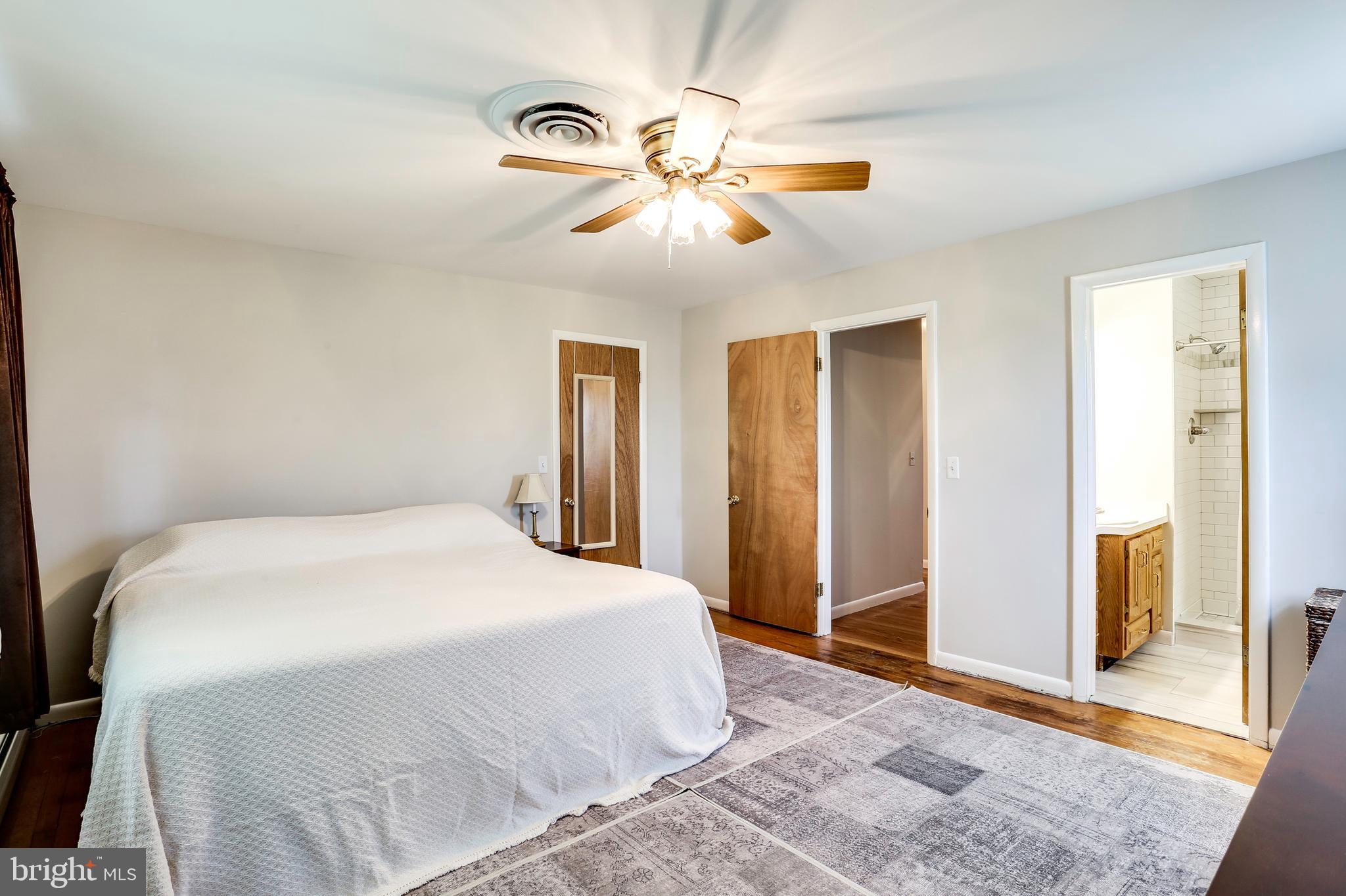 4930 Solomons Island Road Harwood, MD 20776 - Photo 13 of 31 Master Bedroom w/walk-in closet and bath