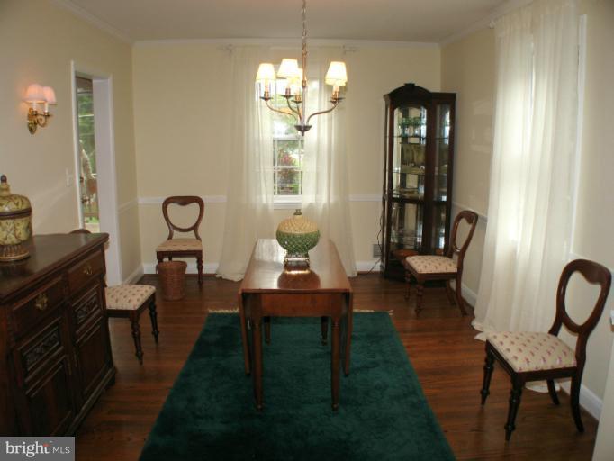 190 Stanmore Road Baltimore, MD 21212 - Photo 1 of 15 a living room with furniture and a chandelier