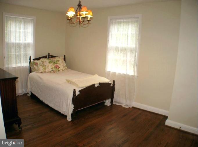 190 Stanmore Road Baltimore, MD 21212 - Photo 6 of 15 a bedroom with a bed and window