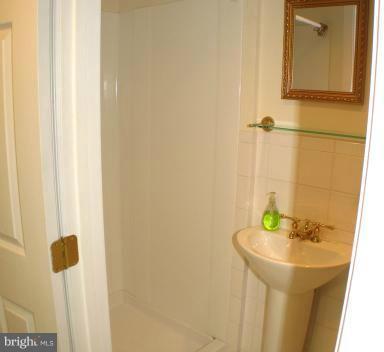 190 Stanmore Road Baltimore, MD 21212 - Photo 10 of 15 a bathroom with a sink and a mirror