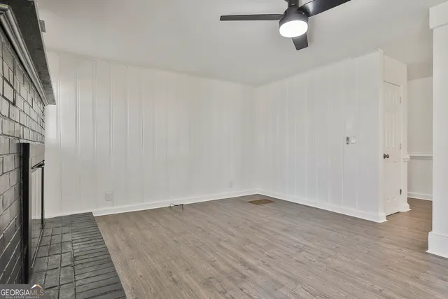 wooden floor in an empty room with a window