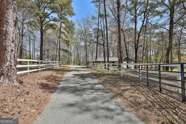 a view of outdoor space with deck and trees