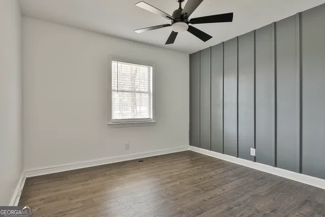 a view of a room with wooden walls