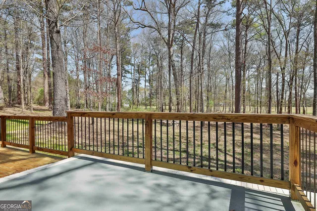 a view of a yard with large trees