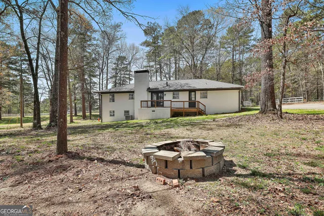 a house with trees in the background