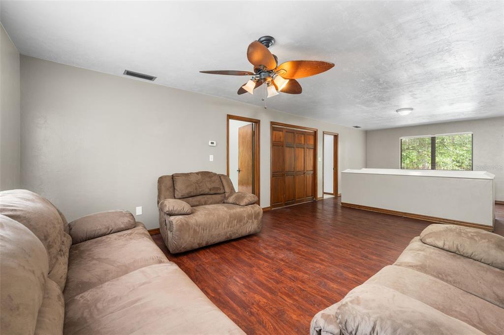 4703 Northwest 124th Street Gainesville, FL 32606 - Photo 42 of 55 a living room with furniture and a window